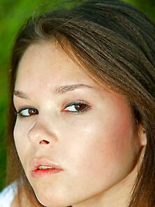 Cute Teen Plays In The Sunny Green Grass...