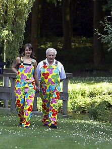 Chick And Her Stepfather In Flower Overalls Go To Nature For Pus