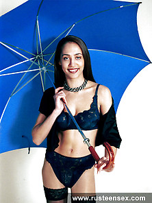 Teen Posing With Umbrella And Stockings